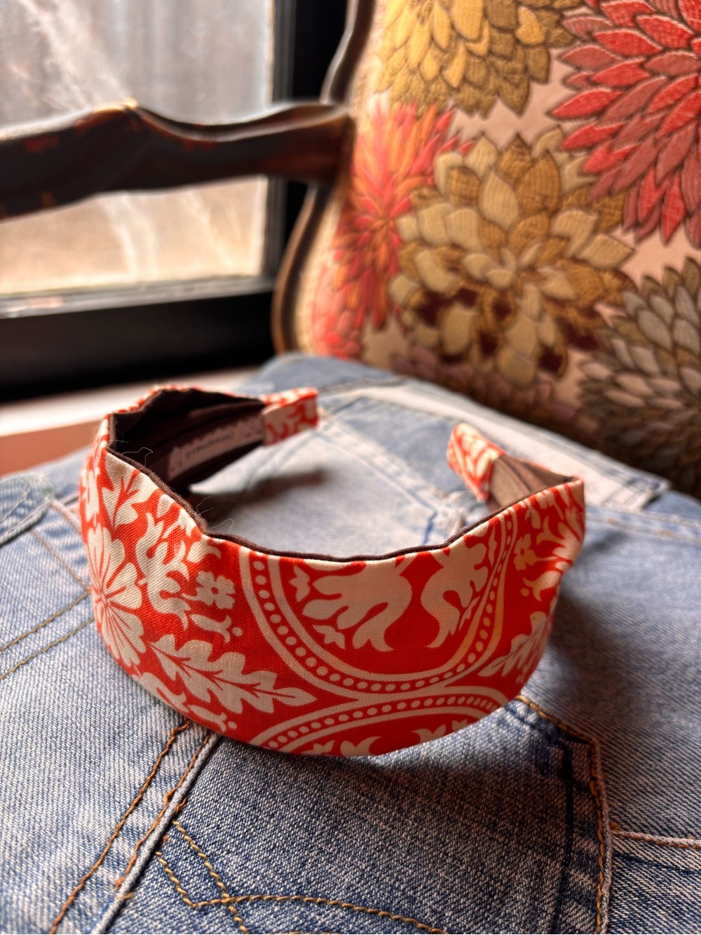 Orange and white fabric covered plastic headband